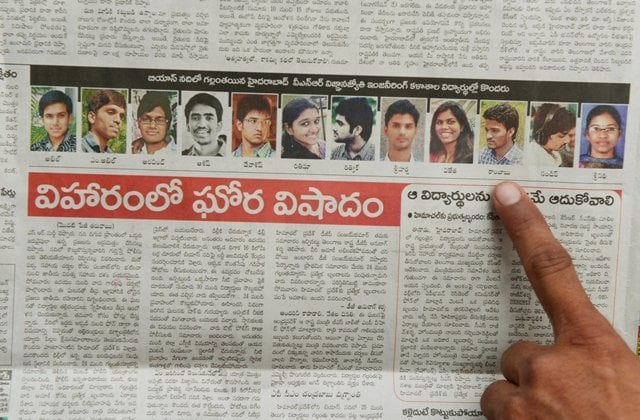 a parent points to a photograph of a missing student feared drowned in the beas river published in a local newspaper on june 9 2014 photo reuters