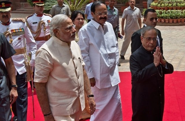 indian president pranab mukherjee gestures a greeting as he arrives with indian prime minster narendra modi to address the joint session of parliament in new delhi photo afp indian president pranab mukherjee gestures a greeting as he arrives with indian prime minster narendra modi to address the joint session of parliament in new delhi photo afp