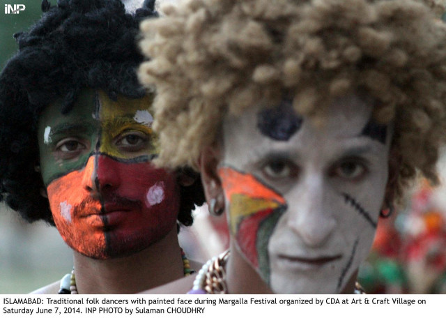 traditional folk dancers with painted face during margalla festival photo inp traditional folk dancers with painted face during margalla festival photo inp