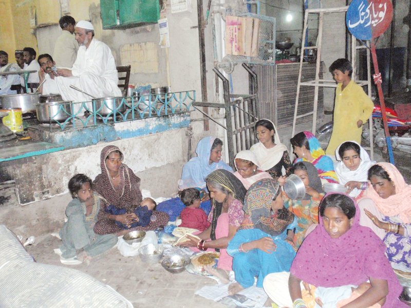 the gharib nawaz hotel provides food to those who cannot afford it photo express