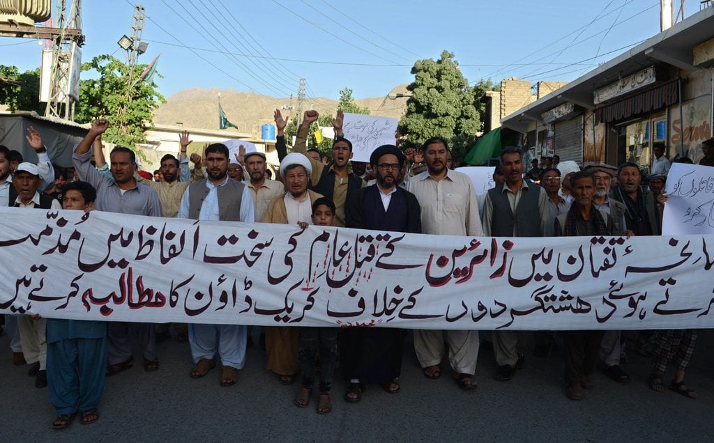 people march against the killing of shia pilgrims during a protest in quetta on june 9 2014 photo afp