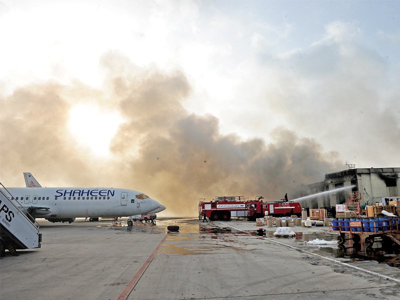 firefighters extinguish the blaze after militants attacked the airport photo afp