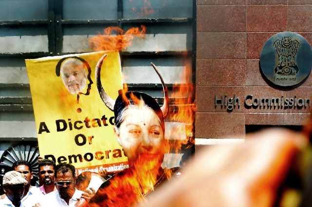 sri lankan pro government supporters burn a larger than life photograph of tamil nadu state chief minister jayalalitha jayaram during a demonstration outside the indian high commission in colombo on june 10 2014 the activists denounced india s new prime minister narendra modi and jayaram for allegedly interfering in sri lanka s domestic politics photo afp sri lankan pro government supporters burn a larger than life photograph of tamil nadu state chief minister jayalalitha jayaram during a demonstration outside the indian high commission in colombo on june 10 2014 the activists denounced india s new prime minister narendra modi and jayaram for allegedly interfering in sri lanka s domestic politics photo afp