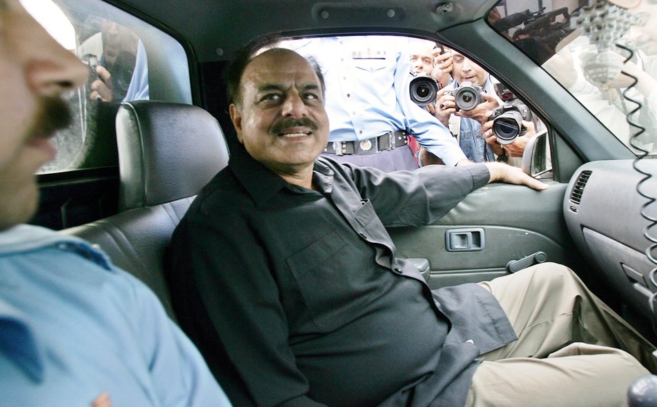 a file picture taken on november 4 2007 shows hamid gul in a police van in islamabad photo afp