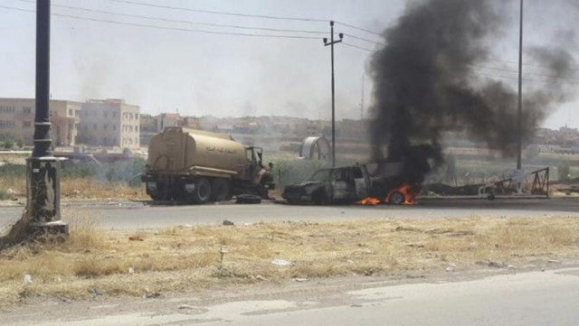 burning vehicles belonging to iraqi security forces are seen during clashes between iraqi security forces and al qaeda linked islamic state in iraq and the levant isil in the northern iraq city of mosul june 10 2014 photo reuters burning vehicles belonging to iraqi security forces are seen during clashes between iraqi security forces and al qaeda linked islamic state in iraq and the levant isil in the northern iraq city of mosul june 10 2014 photo reuters