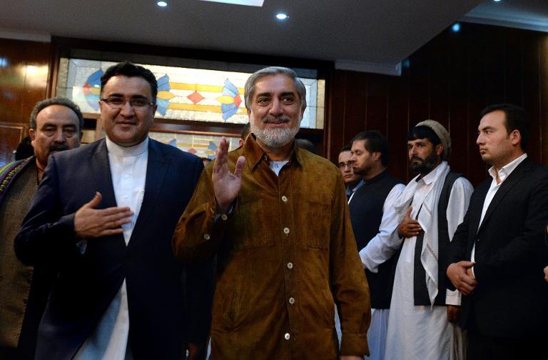 afghan presidential candidate abdullah abdullah arrives at an election gathering after surviving a suicide attack on his convoy in kabul on june 6 2014 photo afp