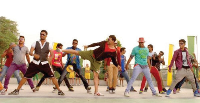 the vibrant bermudas and sneakers combination doesn t complement kumar s rugged persona and sonakshi s way of carrying out the athletic scenes in the film is crude photos file the vibrant bermudas and sneakers combination doesn t complement kumar s rugged persona and sonakshi s way of carrying out the athletic scenes in the film is crude photos file