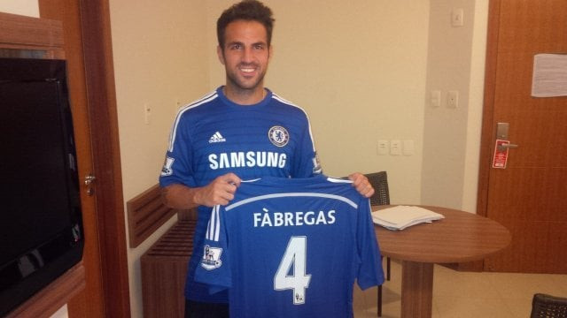 fabregas is all smiles with his new club 039 s football jersey photo chelsea fc website fabregas is all smiles with his new club 039 s football jersey photo chelsea fc website