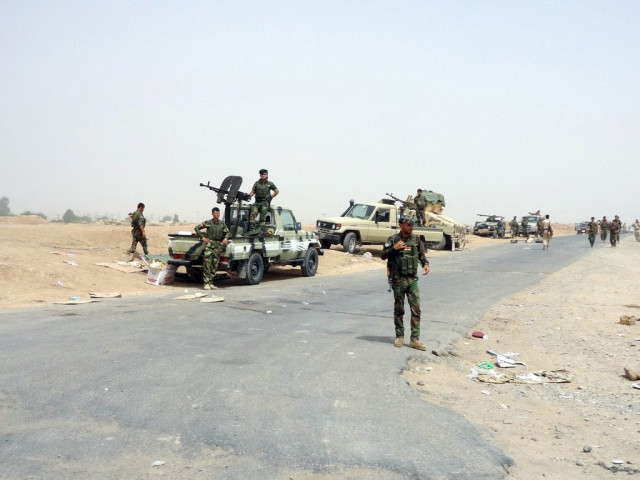 kurdish iraqi peshmerga forces deploy their troops and armoured vehicles on the outskirts of the multi ethnic city of kirkuk only 1 kilometre away from areas controlled by sunni muslim jihadists from the islamic state of iraq and the levant isil in northern iraq on june 12 2014 photo afp kurdish iraqi peshmerga forces deploy their troops and armoured vehicles on the outskirts of the multi ethnic city of kirkuk only 1 kilometre away from areas controlled by sunni muslim jihadists from the islamic state of iraq and the levant isil in northern iraq on june 12 2014 photo afp
