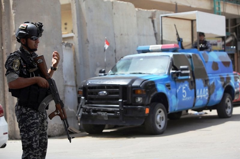 iraqi policemen man a checkpoint in the capital baghdad on june 12 2014 as rebels and anti government fighters have spearheaded a major offensive that overrun all of nineveh province photo afp