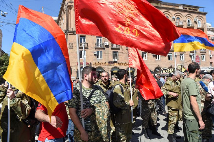 People attend a meeting to recruit military volunteers after Armenian authorities declared martial law and mobilised its male population following clashes with Azerbaijan over the breakaway Nagorno-Karabakh region in Yerevan, Armenia, September 27. PHOTO: REUTERS