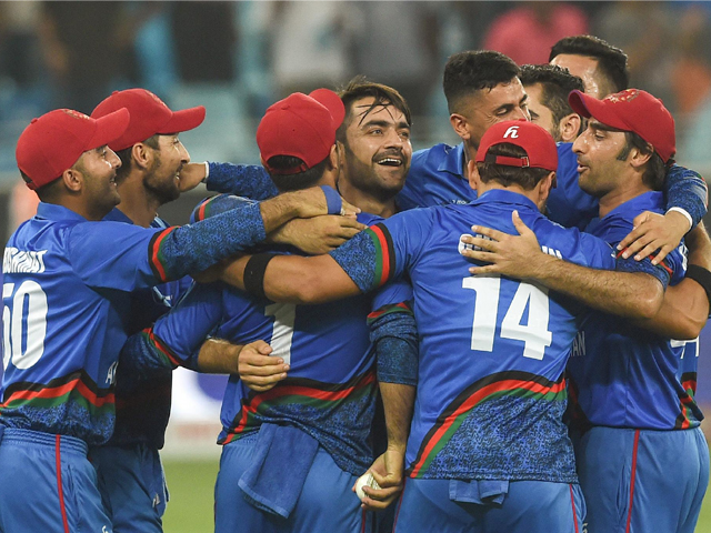 afghan cricketer rashid khan c and captain asghar afghan r celebrate with teammates after the match tied against india in the asia cup in dubai on september 25 2018 photo getty