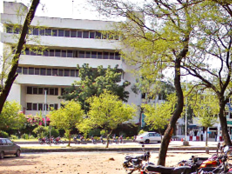 a green belt outside federal urdu university has been substituting as a parking lot for years photo express muhammad javaid