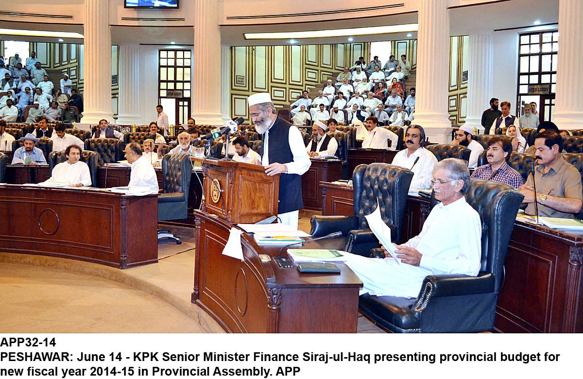 khyber pakhtunkhwa finance minister sirajul haq presenting the provincial budget on saturday as k p chief minister pervez khattak reviews the budget document photo app