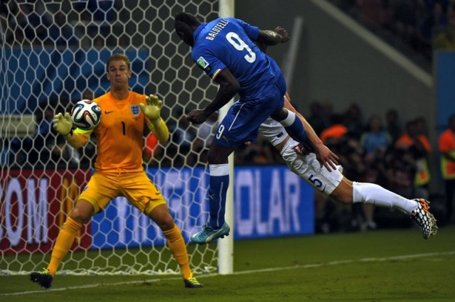 italy 039 s forward mario balotelli l and england 039 s defender gary cahill vie for the ball during a group d football match between england and italy at the amazonia arena in manaus during the 2014 fifa world cup on june 14 2014 photo afp