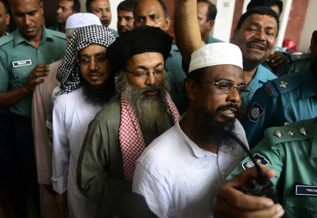 harkat ul jihad al islami huji leader mufti abdul hannan r is flanked by police officers as he appears in court in dhaka on june 16 2014 photo afp harkat ul jihad al islami huji leader mufti abdul hannan r is flanked by police officers as he appears in court in dhaka on june 16 2014 photo afp