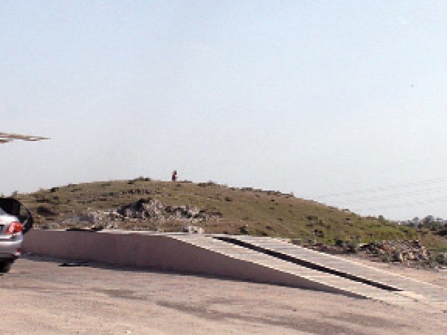 the mound is located in sector e 11 next to the pakistan medical cooperative housing society islamabad photo express
