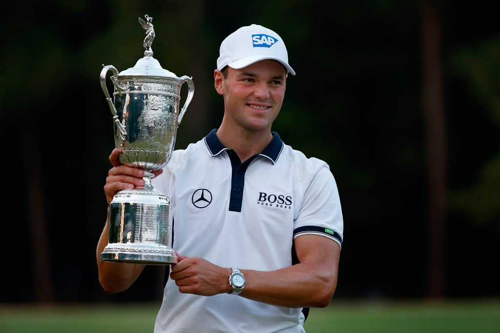 martin kaymer of germany celebrates with the trophy after his eight stroke victory during the final round of the 114th us open at pinehurst resort amp country club course no 2 on june 15 2014 in pinehurst north carolina photo afp