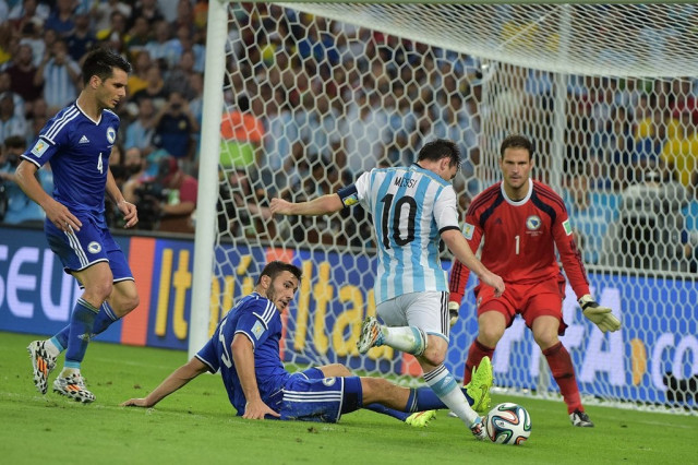 argentina 039 s forward and captain lionel messi fights for the ball with bosnia hercegovina 039 s defender and captain emir spahic and bosnia hercegovina 039 s defender sead kolasinac 2l during a group f football match between argentina and bosnia hercegovina at the maracana stadium in rio de janeiro during the 2014 fifa world cup on june 15 2014 photo afp argentina 039 s forward and captain lionel messi fights for the ball with bosnia hercegovina 039 s defender and captain emir spahic and bosnia hercegovina 039 s defender sead kolasinac 2l during a group f football match between argentina and bosnia hercegovina at the maracana stadium in rio de janeiro during the 2014 fifa world cup on june 15 2014 photo afp