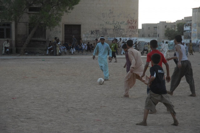 children playing football in karachi photo express irfan ali children playing football in karachi photo express irfan ali