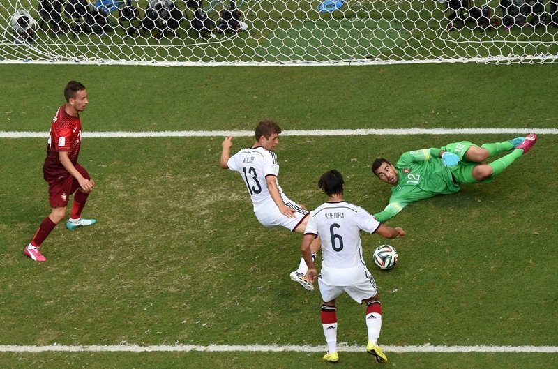 germany 039 s forward thomas mueller c is watched by germany 039 s midfielder sami khedira 2r as he scores his third goal past portugal 039 s goalkeeper rui patricio r during the group g football match between germany and portugal at the fonte nova arena in salvador on june 16 2014 during the 2014 fifa world cup photo afp