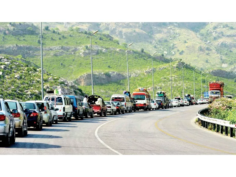 queues of cars and vans carrying tribesmen from north waziristan wait to clear darra adam khel check post photo afp queues of cars and vans carrying tribesmen from north waziristan wait to clear darra adam khel check post photo afp