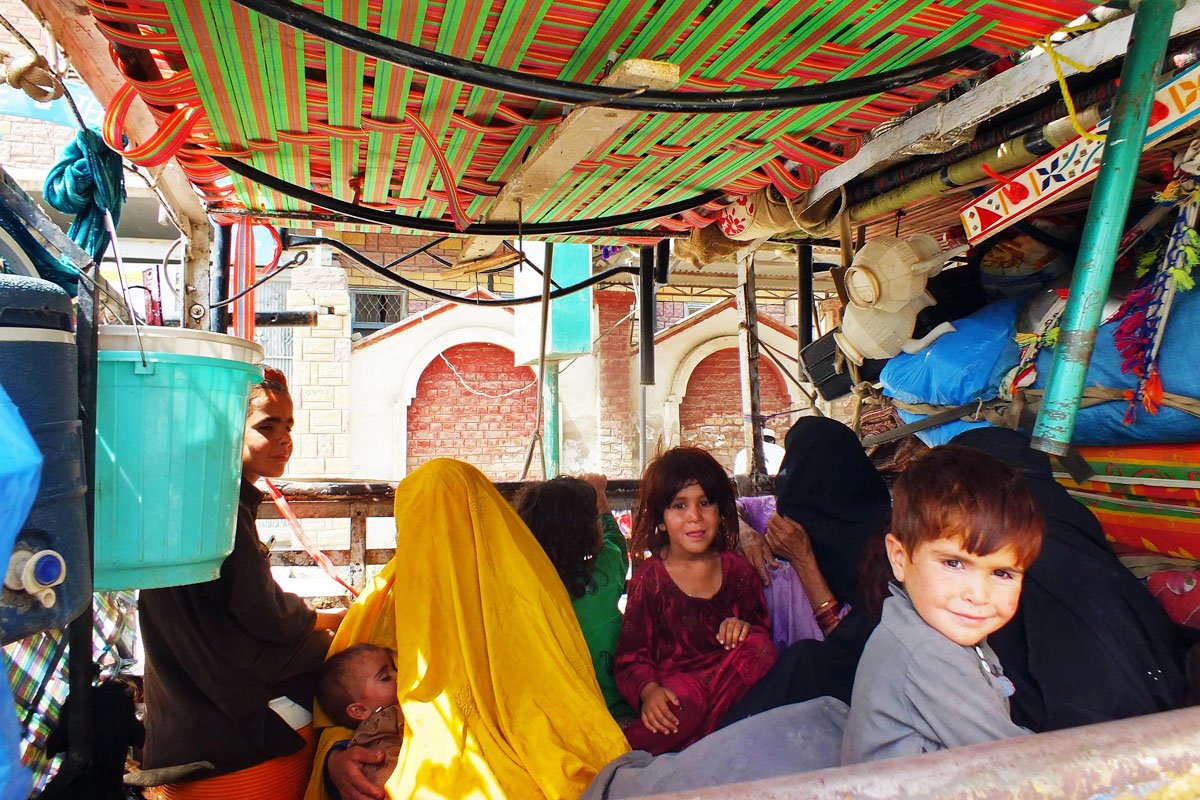 a family with all their belongings packed in the back of mini truck seen in bannu fleeing the military operation in north waziristan tribal agency photo afp