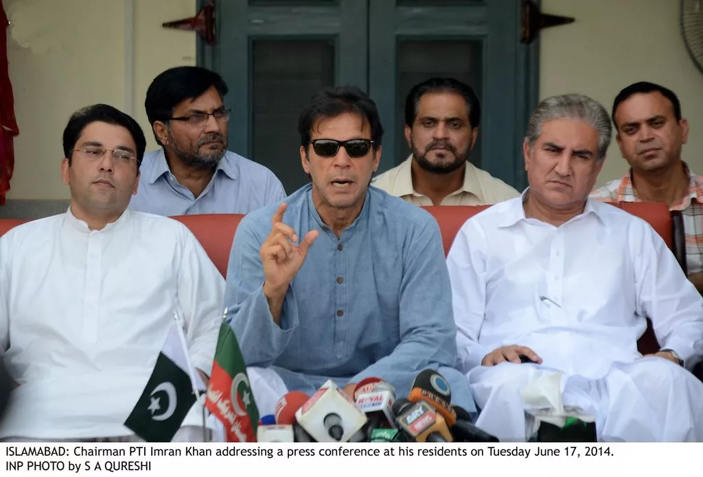 chairman pti imran khan c addressing a press conference at his residence on tuesday june 17 2014 photo inp chairman pti imran khan c addressing a press conference at his residence on tuesday june 17 2014 photo inp
