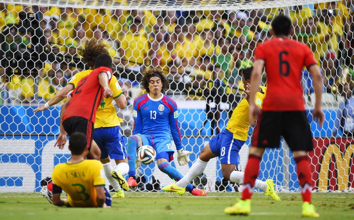 mexico 039 s goalkeeper guillermo ochoa c controls the ball during a group a football match between brazil and mexico in the castelao stadium in fortaleza during the 2014 fifa world cup on june 17 2014 photo afp