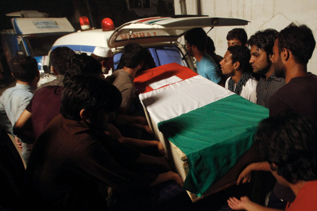 a coffin bearing a slain supporter of tahirul qadri killed during clashes with police is shifted into an ambulance during a funeral ceremony in lahore photo afp a coffin bearing a slain supporter of tahirul qadri killed during clashes with police is shifted into an ambulance during a funeral ceremony in lahore photo afp