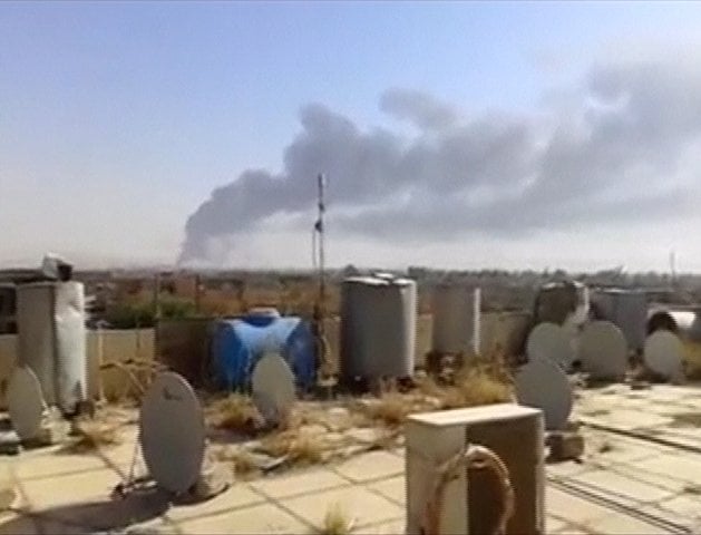 a large plume of smoke rises from what is said to be baiji oil refinery in baiji northern iraq photo reuters