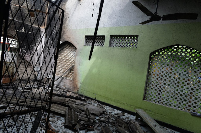 the charred interior of a mosque is pictured following clashes between muslims and an extremist buddhist group in the town of alutgama on june 16 2014 photo afp the charred interior of a mosque is pictured following clashes between muslims and an extremist buddhist group in the town of alutgama on june 16 2014 photo afp
