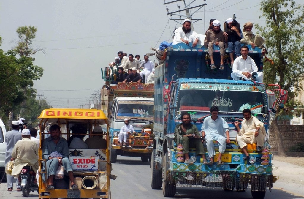 civilians fleeing from a military operation in north waziristan tribal agency arrive in bannu district on june 18 2014 photo afp