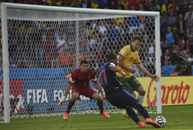 australia 039 s defender alex wilkinson r vies with netherlands 039 forward jeremain lens during a group b football match between australia and the netherlands at the beira rio stadium in porto alegre during the 2014 fifa world cup on june 18 2014 photo afp australia 039 s defender alex wilkinson r vies with netherlands 039 forward jeremain lens during a group b football match between australia and the netherlands at the beira rio stadium in porto alegre during the 2014 fifa world cup on june 18 2014 photo afp