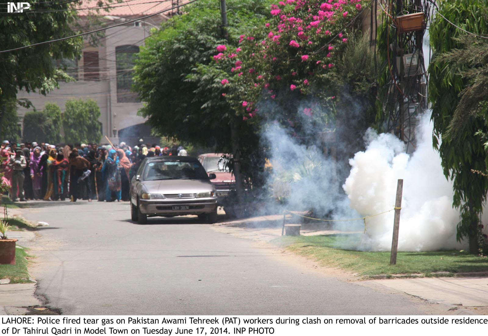 dozens of supporters of tahirul qadri in lahore were assaulted by the police when they resisted the removal of barricades protecting qadri s house in model town photo inp