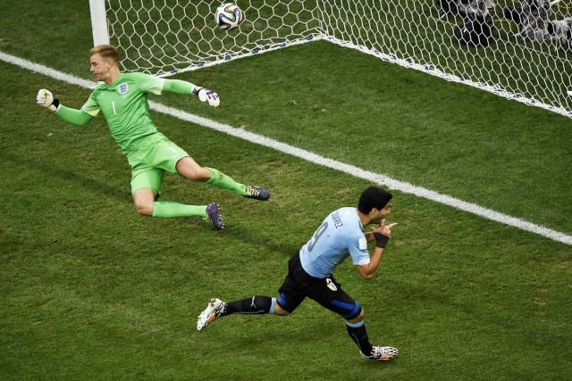 uruguay 039 s forward luis suarez r celebrates after scoring against england 039 s goalkeeper joe hart l during a group d football match between uruguay and england at the corinthians arena in sao paulo during the 2014 fifa world cup on june 19 2014 photo afp uruguay 039 s forward luis suarez r celebrates after scoring against england 039 s goalkeeper joe hart l during a group d football match between uruguay and england at the corinthians arena in sao paulo during the 2014 fifa world cup on june 19 2014 photo afp