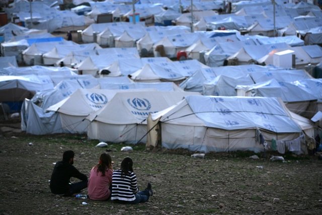 a file picture taken on february 13 2014 shows syrian kurdish refugees siting in the quru gusik kawergosk refugee camp 20 kilometres east of arbil the capital of the autonomous kurdish region of northern iraq