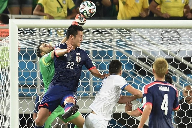 strong hold japan were unable to break a 10 man greek defence to draw 0 0 photo afp