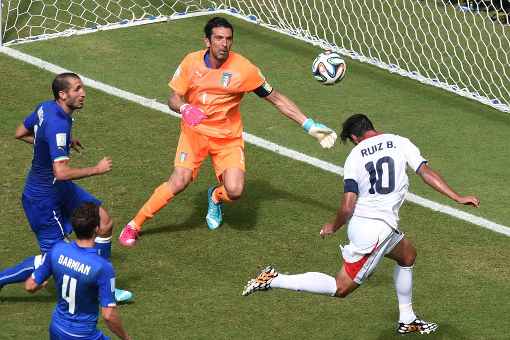costa rica 039 s forward bryan ruiz r heads the ball to score as italy 039 s goalkeeper gianluigi buffon 2nd r looks on during a group d football match between italy and costa rica at the pernambuco arena in recife during the 2014 fifa world cup on june 20 2014 photo afp