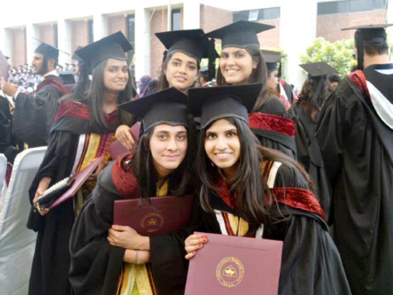 students pose for a picture in their convocation gowns photo maham hameed