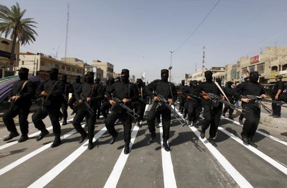 mehdi army fighters loyal to shia cleric moqtada al sadr take part during a parade in baghdad 039 s sadr city june 21 2014 photo reuters