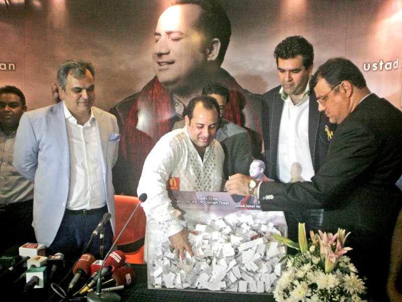 rahat fateh ali draws the name of the person who will accompany him on his uk tour this year photo athar khan express