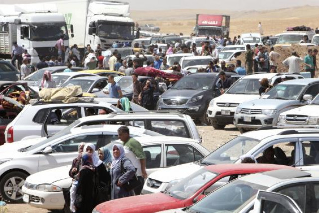families fleeing the violence in the iraqi city of mosul wait at a checkpoint in outskirts of arbil in iraq 039 s kurdistan region photo reuters families fleeing the violence in the iraqi city of mosul wait at a checkpoint in outskirts of arbil in iraq 039 s kurdistan region photo reuters