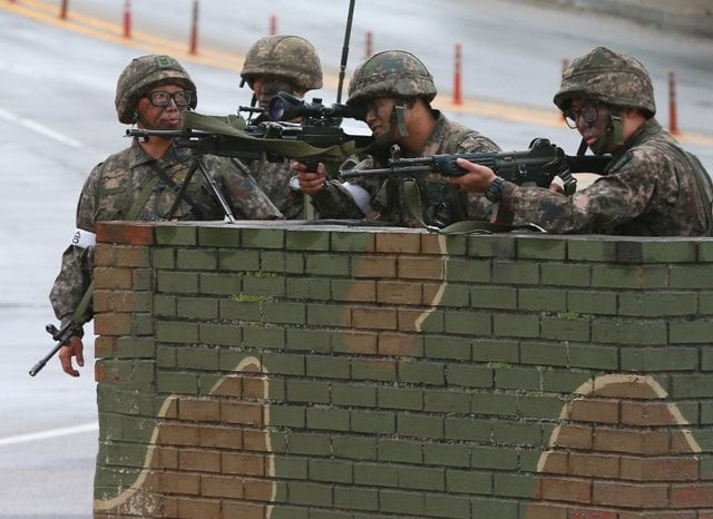 south korean soldiers man a checkpoint near the demilitarized zone between the two koreas photo afp south korean soldiers man a checkpoint near the demilitarized zone between the two koreas photo afp