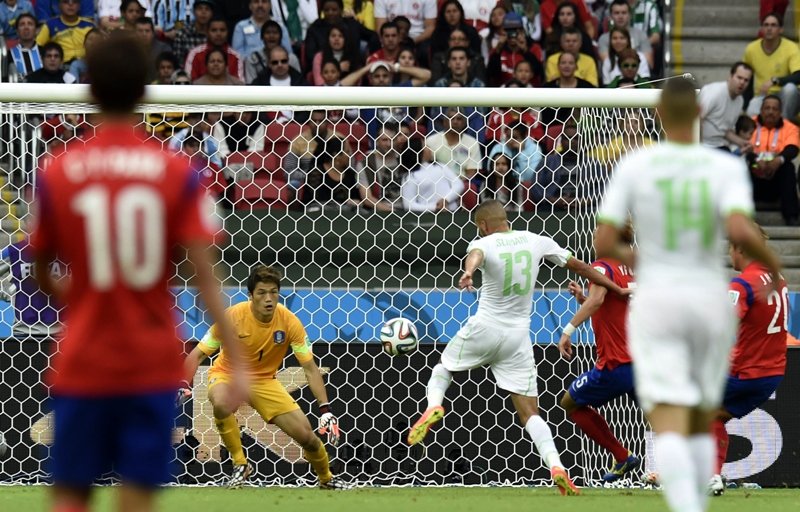 south korea 039 s goalkeeper jung sung ryong l fails to stop the ball as algeria 039 s forward islam slimani r scores his team 039 s first goal during the group h football match between south korea and algeria at the beira rio stadium in porto alegre during the 2014 fifa world cup on june 22 2014 photo afp