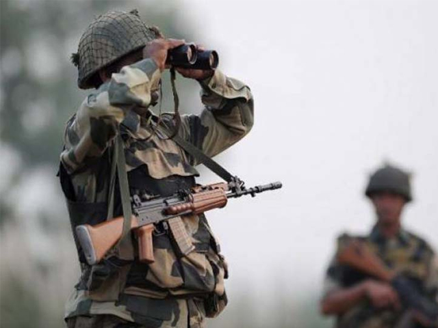 an indian border security force bsf soldier looks through binoculars during a patrol at the india pakistan border in r s pora southwest of jammu on october 3 2016 photo afp