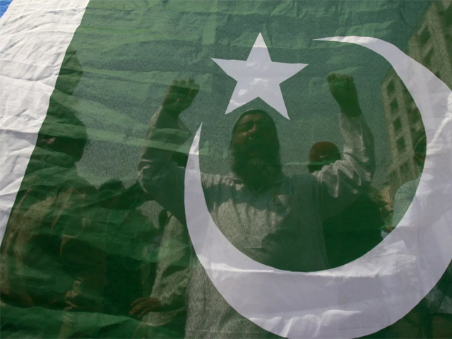 activists of pakistan 039 s islamist party jamaat e islami chant slogans behind a flag during countrywide anti government protest rally in karachi march 12 2009 photo reuters