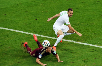 slimani heads algeria level against russia secures historic last 16 qualification