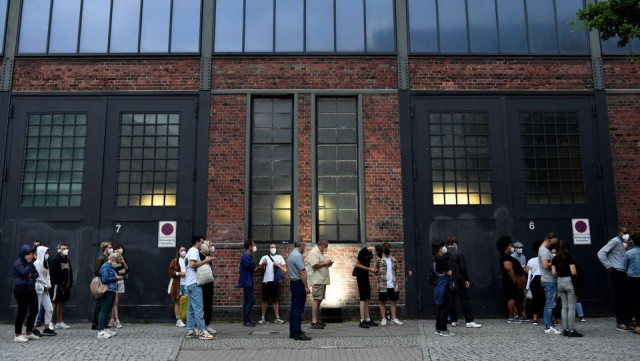 people queue to receive a vaccine against the coronavirus disease covid 19 during a night of vaccinations with music at the arena treptow vaccination centre in berlin germany august 9 2021 photo reuters file people queue to receive a vaccine against the coronavirus disease covid 19 during a night of vaccinations with music at the arena treptow vaccination centre in berlin germany august 9 2021 photo reuters file