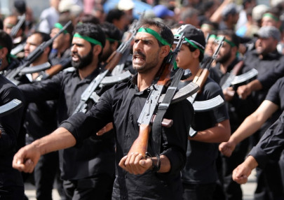 crisis hit iraq turns to militias for support